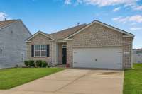 Side view of home with 2 car garage