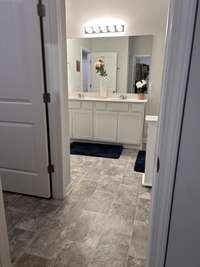 Primary Bathroom from walk-in closet view