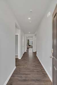 My entry hallway is wide and has a coat closet at entryway and another closet beyond the first 2 bedrooms.