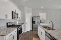 My kitchen has a huge pantry located just left of the refrigerator (that also stays)!