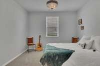 Bedroom 4 is located on the garage side with a side view window.