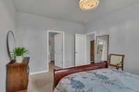 Welcome to my primary bedroom!  I overlook the fenced backyard and open common area behind. So serene and private!