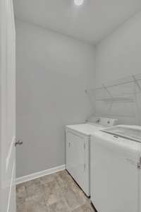 Washer & Dryer stay and are located just across from the inside garage door. It's central location is convenient to all 4 bedrooms!