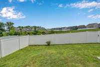 Fence in backyard is equipped with 2 entry gates!