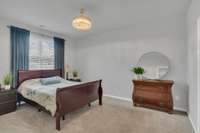 Primary bedroom - overlooks the fenced backyard and open common area. Relax and enjoy the serenity.