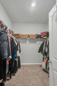 You'll absolutely LOVE this walk-in closet located in the primary bath!