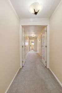 Short flight of stairs and french doors lead to the upstairs floor