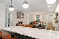 The kitchen is open to the den offering a relaxed and functional flow for everyday living or entertaining