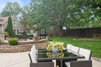 There is so much space! A dining area near the pool, a paver patio above the retaining wall offers a fire pit and grilling area - there is also a spa!