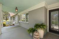 A welcoming covered front porch complete with porch swing