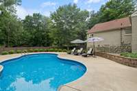 Perfectly manicured, the entire backyard is enclosed with a privacy fence