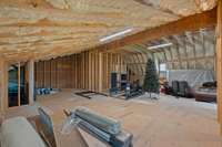 The 2nd floor has room for interior expansion! It is pre-plumbed for a full bath, has it's own electrical panel ready in place, can easily pull in 2nd floor laundry, and situated above garage to accommodate an elevator if needed in the future.