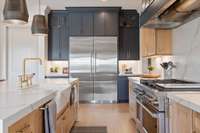 Live your culinary dreams with Fischer and Paykel Appliances, a SOLID BRASS faucet over the farm sink, two dishwashers with cabinet finish, and the commercial grade 30" Fridge with 30" Freezer!