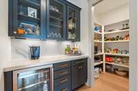 Butler's Pantry with beverage fridge and coffee station.