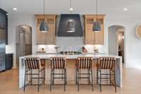 Stunning kitchen finishes with custom Bishop soft close cabinetry... which is found throughout the home.