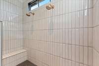 Dual Shower heads, seat/shaving ledge, and beautiful tiles!