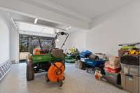 5th garage is in the basement with utility sink.