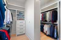Custom primary closet, finished out with real wood, as the same for all closets throughout the home! Functionality at it's finest!