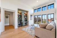 Second floor open den with custom built-in study area! Gorgeous windows and soaring ceilings!