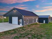 50'x30' Workshop with carport, RV hookup, welder's outlet, HVAC, Full Bath, Kitchenette hookups, Washer and Dryer Hookups.