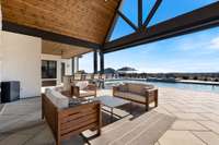 Pictures do not do justice!! Dramatic cathedral wood ceiling covers the outdoor living area!