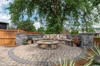 Huge seating wall surrounds this awesome custom firepit area