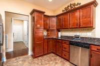 View showing the abundant cabinetry - and the cool "garage" nook area in the corner