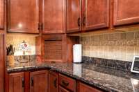 Beautiful granite countertops with attractive stone backsplash