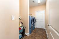 Huge Laundry Room with view towards the garage