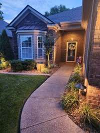 Convenient walkway to the covered porch entry