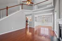 Living space flows into the formal dinning area with a loft overhead.