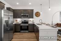 Stylish finishes including quartz countertops, a ceramic tile backsplash & pendant lighting are all included.