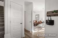 The front entry features a foyer, coat closet & access to your main-floor full bathroom.