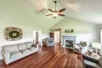 Your living view boasts beautiful cherry hardwood floors and a vaulted ceiling!