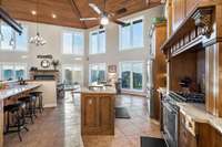 Even the view from the kitchen is amazing! And look at how much seating is available for entertaining - at the breakfast bar, the breakfast nook, and more at the island if desired.