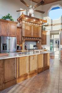 Large island with farmhouse sink.