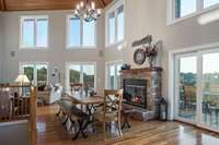 Stacked stone fireplace for those chilly Fall nights. This area is being used as a dining room to accommodate large gatherings, but would also be perfect as a sitting area.