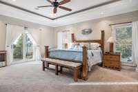 Large primary suite with a balcony to enjoy the lake views, an en-suite bath, and large walk-in closet with organizers and built-ins.