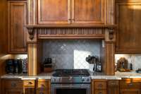 Custom pull-out spice drawers surround the gas stove so that all your spices are at hand.  The gas stove also has a baking drawer.