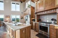 The quartz countertops match the cabinetry, fixtures, and backsplash perfectly.