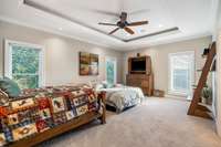 Second bedroom on the main level also has an en-suite bath, walk-in closet, and a view of the lake.