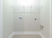 Utility closet conveniently located between the two upstairs bedrooms.