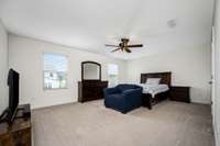 Upstairs primary bedroom with it's own full bath and walk-in closet.