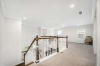 Loft space at top of stairs has lots of potential!