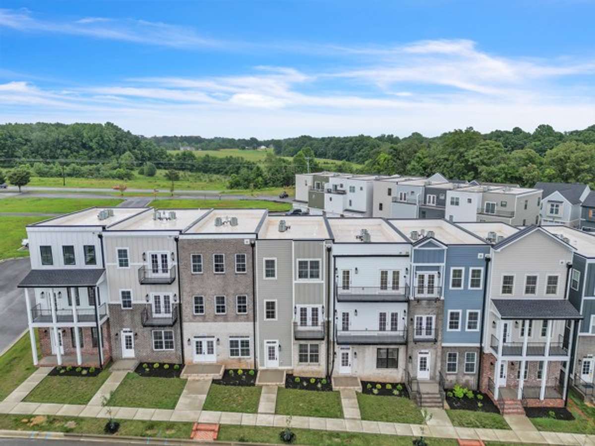 A beautiful shot of the 7 town home units each with its own unique design & features! Notice the sidewalks that run through out Pleasant View Village.