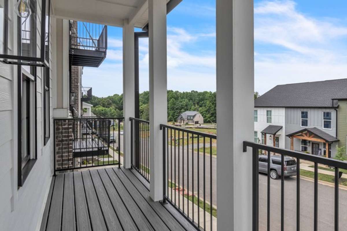 Adorable covered deck to enjoy your morning coffee. What a great space for the cook to grow a kitchen garden and feature seasonal flowers.