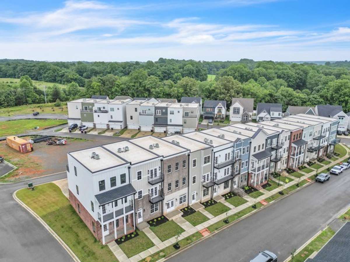 Pleasant View Village featuring luxury town homes tucked in the edge of the neighborhood known as The Charleston Commons. No lawn care!