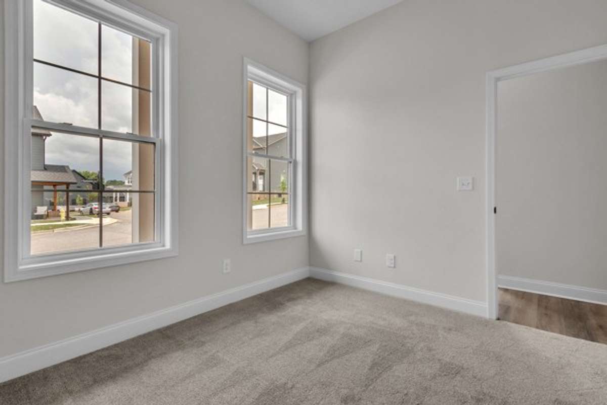Large 1st floor private guest room with 10 foot ceiling, modern ceiling fan recessed lighting.