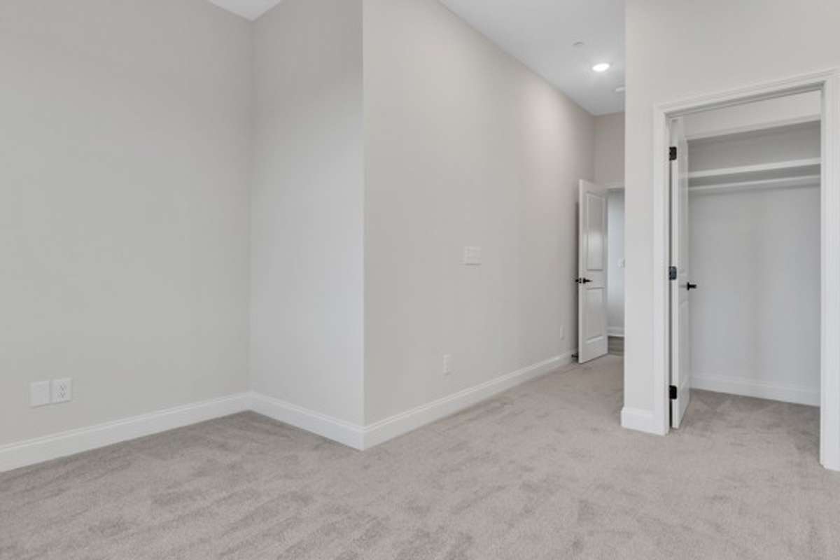 A look back to the entry door of primary suite and the entry of custom closet.