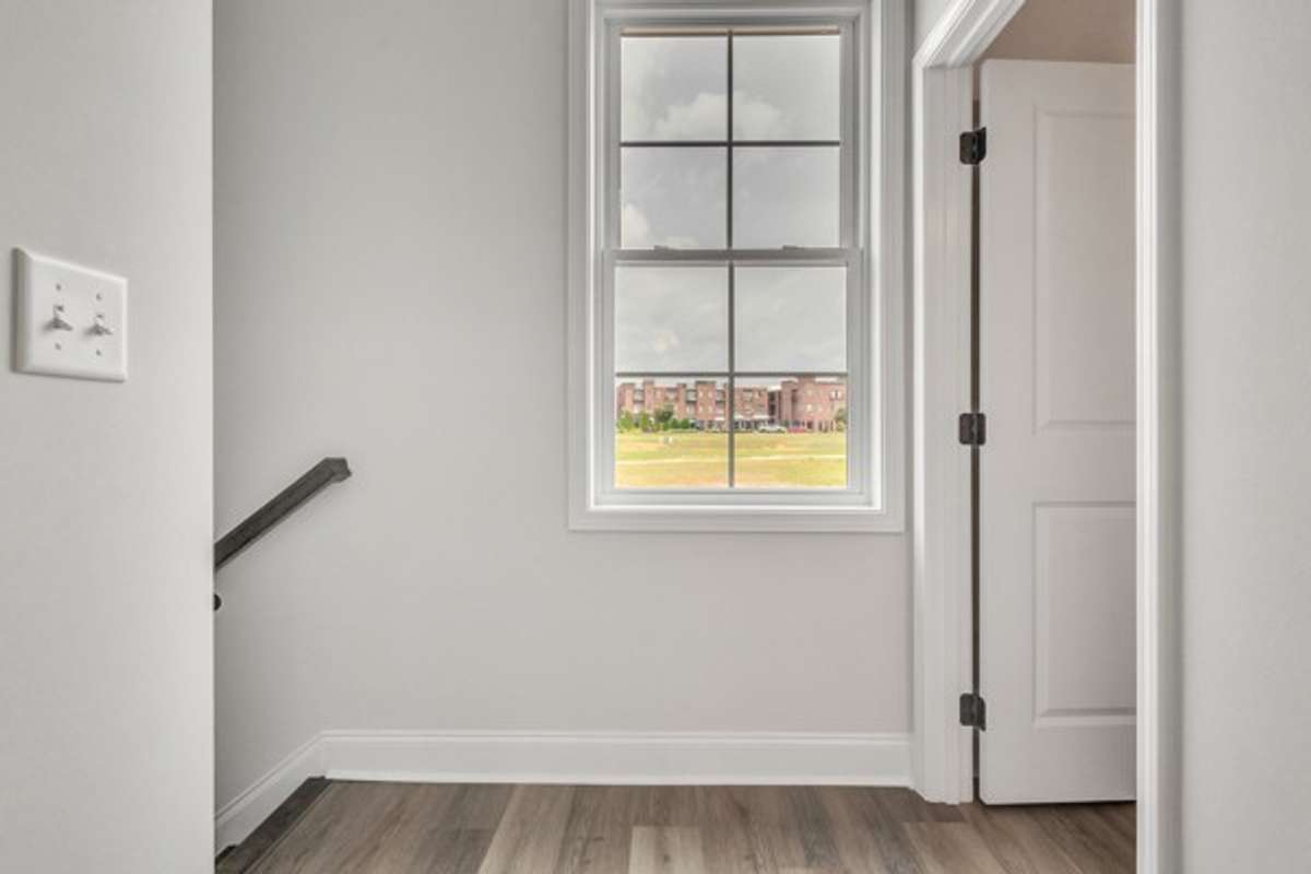 As you enter the 2nd floor, you are welcomed by a window with a great view of the the neighborhood shops & restaurants.
